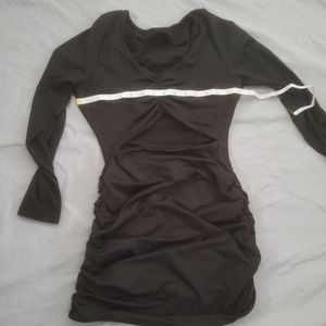 Long sleeve spandex body con dress.  Very flattering hides imperfections